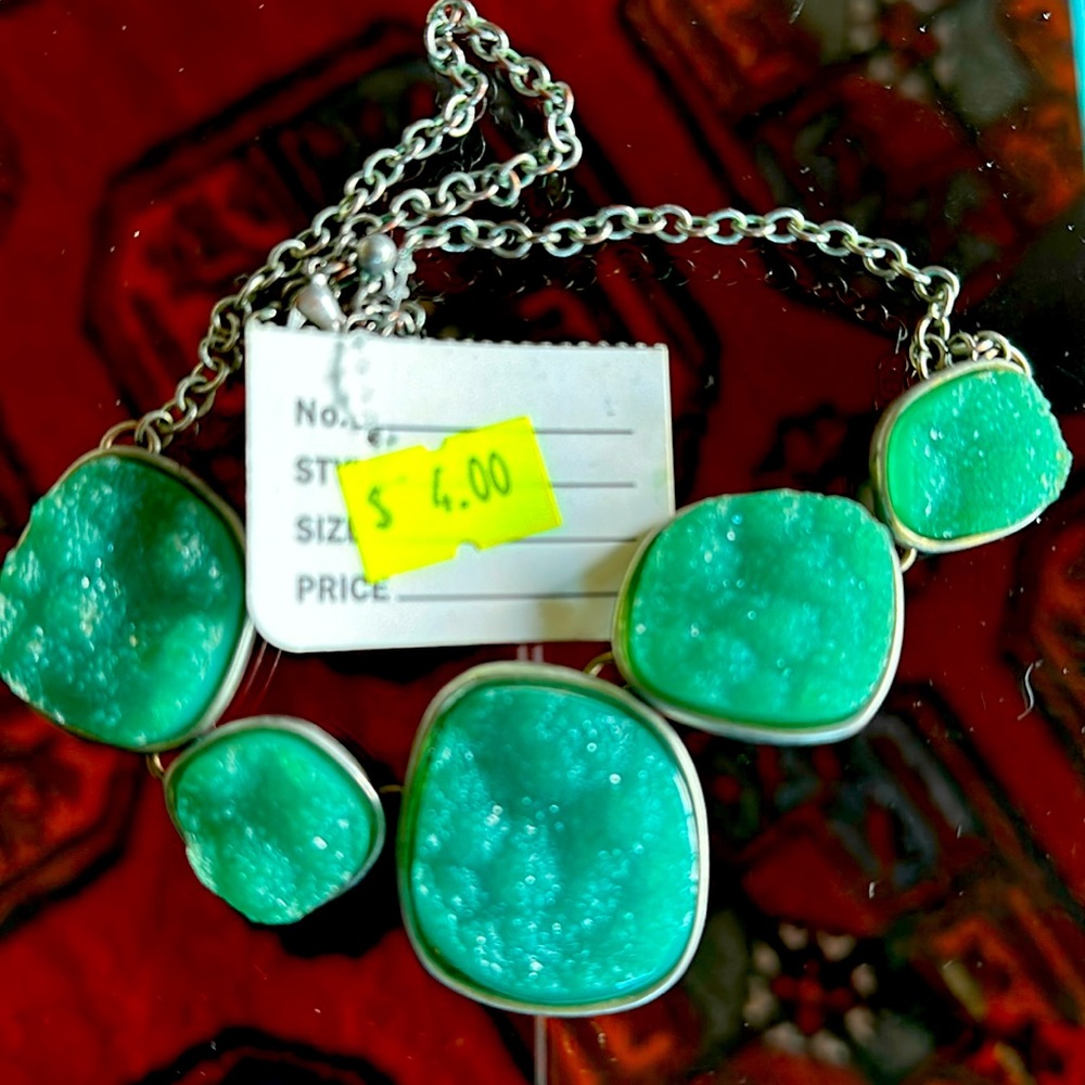 Druzy necklace silver tone clasp five stones of various size. Teal colored stone